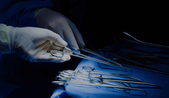Two Hands Holding suture scissors