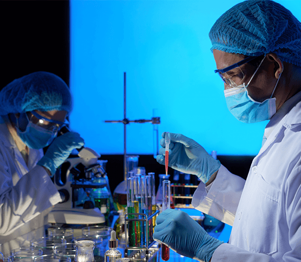 Two Pharmaceutical Scientists Do Testing In Lab