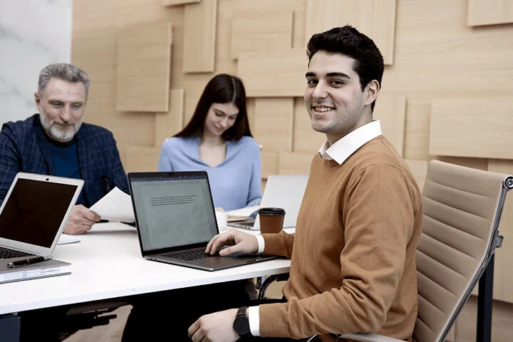 Group Of People Are Happily Engaged In Their Work